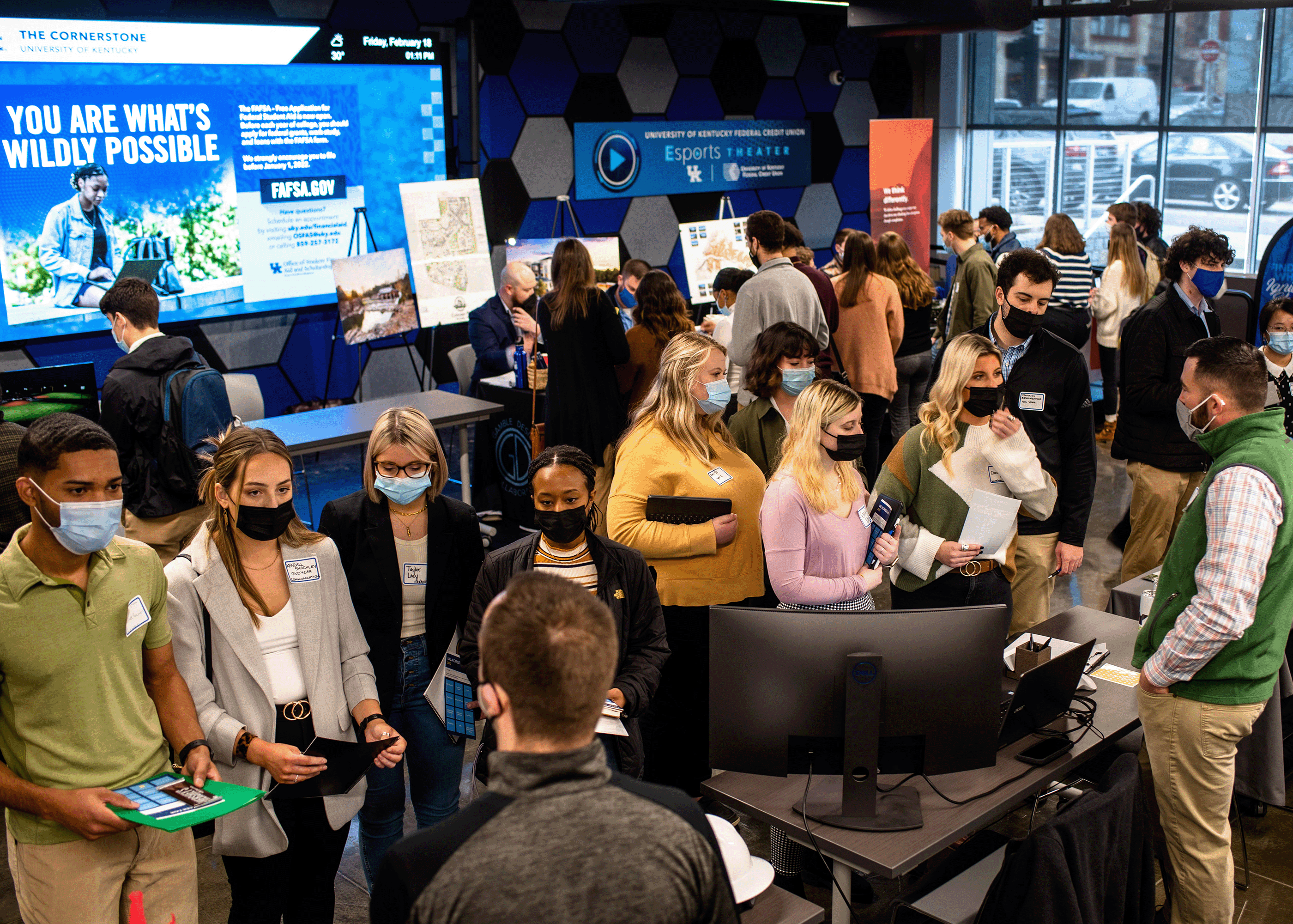 photograph of 2022 career fair with lots of students and firms tabling.