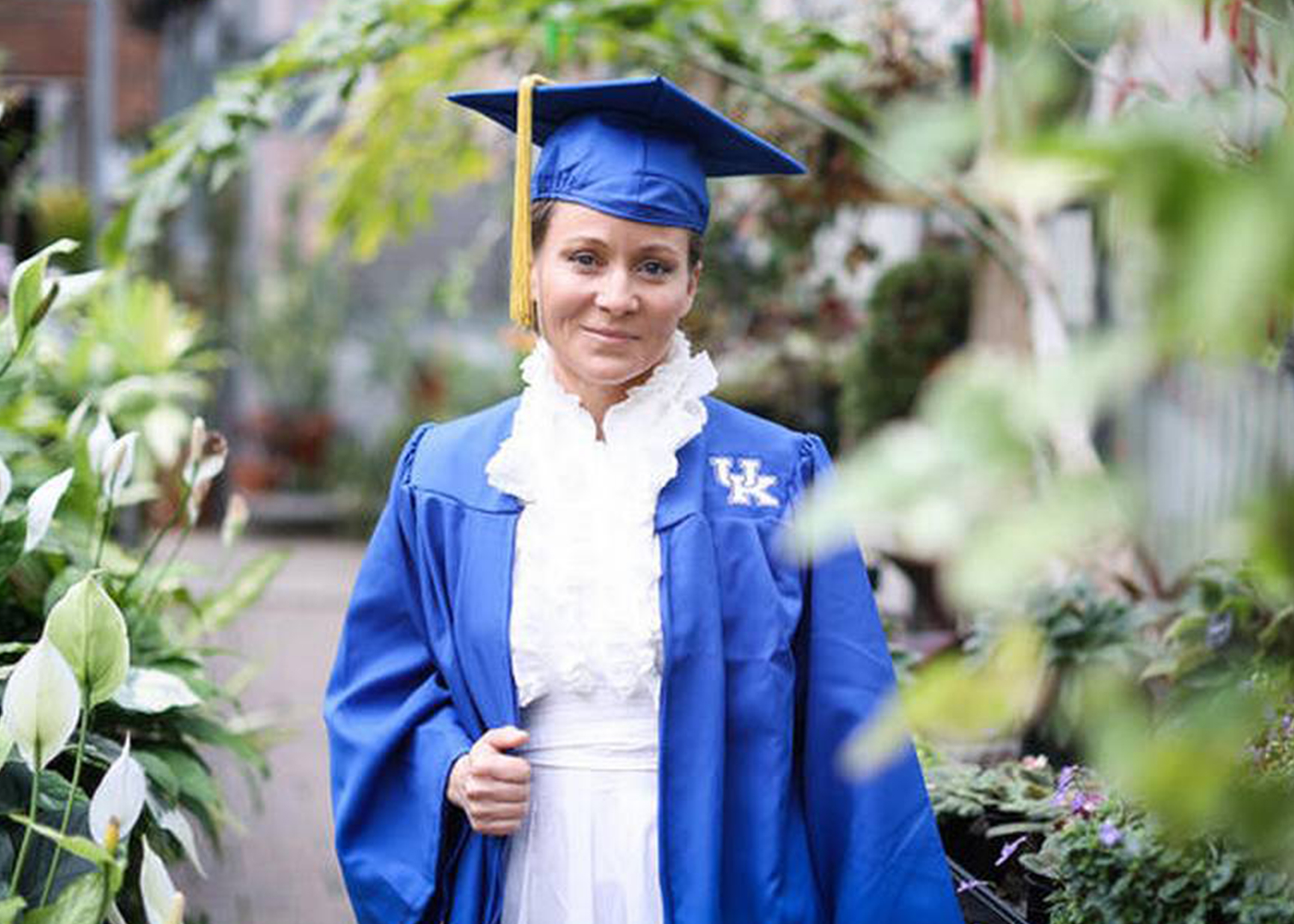 Photograph of Angela Sanchez in cap and gown 