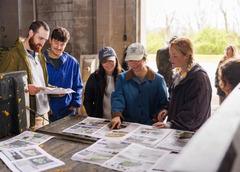 Picture of LA students reviewing their master plan for a Paris, KY project.