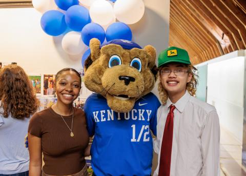 Two UKLA students with UK mascot, Scratch
